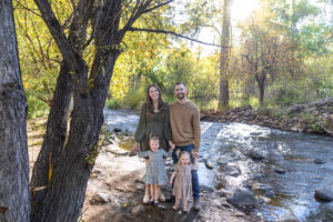 Littleton family photographer mini sessions Morrison Park fall photography Colorado dogs puppies couples mother father kids children siblings bridge river color brother sister baby
