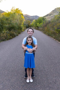 Littleton family photographer mini sessions Morrison Park fall photography Colorado dogs puppies couples mother father kids children siblings bridge river color brother sister baby