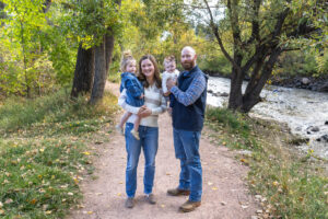 Littleton family photographer mini sessions Morrison Park fall photography Colorado dogs puppies couples mother father kids children siblings bridge river color brother sister baby
