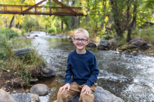 Littleton family photographer mini sessions Morrison Park fall photography Colorado dogs puppies couples mother father kids children siblings bridge river color brother sister baby