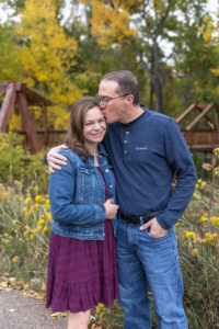 Littleton family photographer mini sessions Morrison Park fall photography Colorado dogs puppies couples mother father kids children siblings bridge river color brother sister baby