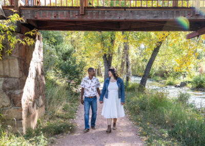 Littleton family photographer mini sessions Morrison Park fall photography Colorado dogs puppies couples mother father kids children siblings bridge river color brother sister baby