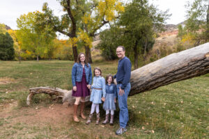 Littleton family photographer mini sessions Morrison Park fall photography Colorado dogs puppies couples mother father kids children siblings bridge river color brother sister baby
