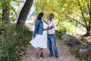 Littleton family photographer mini sessions Morrison Park fall photography Colorado dogs puppies couples mother father kids children siblings bridge river color brother sister baby