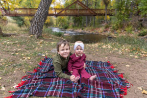 Littleton family photographer mini sessions Morrison Park fall photography Colorado dogs puppies couples mother father kids children siblings bridge river color brother sister baby