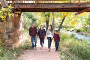 Littleton family photographer mini sessions Morrison Park fall photography Colorado dogs puppies couples mother father kids children siblings bridge river color brother sister baby