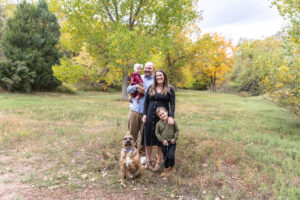 Littleton family photographer mini sessions Morrison Park fall photography Colorado dogs puppies couples mother father kids children siblings bridge river color brother sister baby