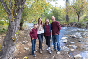 Littleton family photographer mini sessions Morrison Park fall photography Colorado dogs puppies couples mother father kids children siblings bridge river color brother sister baby