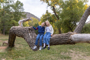 Littleton family photographer mini sessions Morrison Park fall photography Colorado dogs puppies couples mother father kids children siblings bridge river color brother sister baby