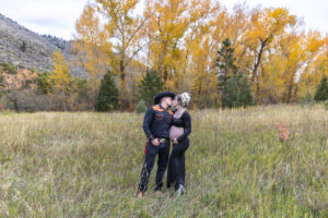 Littleton maternity and baby photographer family bump pregnant pregnancy Lair O' the Bear Park Colorado photography fall color leaves cowboy hats