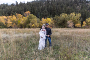 Littleton maternity and baby photographer family bump pregnant pregnancy Lair O' the Bear Park Colorado photography fall color leaves cowboy hats