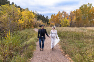 Littleton maternity and baby photographer family bump pregnant pregnancy Lair O' the Bear Park Colorado photography fall color leaves cowboy hats