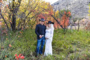 Littleton maternity and baby photographer family bump pregnant pregnancy Lair O' the Bear Park Colorado photography fall color leaves cowboy hats