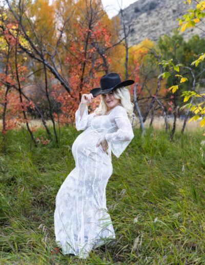 Littleton maternity and baby photographer family bump pregnant pregnancy Lair O' the Bear Park Colorado photography fall color leaves cowboy hats mother