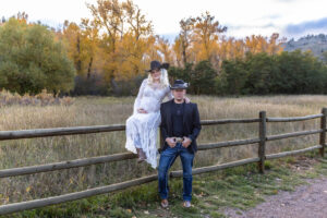 Littleton maternity and baby photographer family bump pregnant pregnancy Lair O' the Bear Park Colorado photography fall color leaves cowboy hats