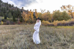 Littleton maternity and baby photographer family bump pregnant pregnancy Lair O' the Bear Park Colorado photography fall color leaves cowboy hats