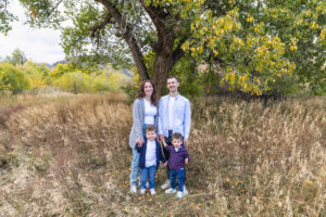 Littleton family photographer boys siblings brothers mother father fall Colorado Hildebrand Ranch photography foothills field Ken Caryl