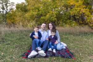 Littleton family photographer boys siblings brothers mother father fall Colorado Hildebrand Ranch photography foothills field Ken Caryl