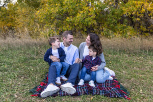 Littleton family photographer boys siblings brothers mother father fall Colorado Hildebrand Ranch photography foothills field Ken Caryl
