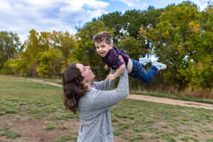 Littleton family photographer boys siblings brothers mother father fall Colorado Hildebrand Ranch photography foothills field Ken Caryl