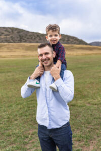 Littleton family photographer boys siblings brothers mother father fall Colorado Hildebrand Ranch photography foothills field Ken Caryl