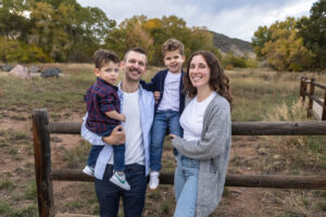Littleton family photographer boys siblings brothers mother father fall Colorado Hildebrand Ranch photography foothills field Ken Caryl