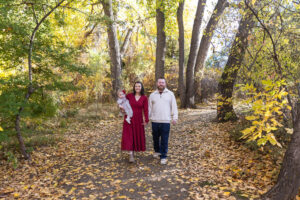 Littleton family photographer Fly'N B park Highlands Ranch Colorado one year old baby mother father child daughter little girl photography fall cake smash