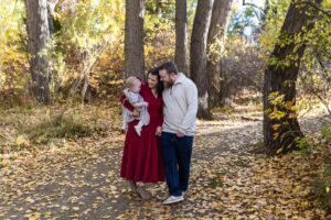 Littleton family photographer Fly'N B park Highlands Ranch Colorado one year old baby mother father child daughter little girl photography fall cake smash