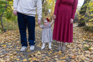 Littleton family photographer Fly'N B park Highlands Ranch Colorado one year old baby mother father child daughter little girl photography fall cake smash