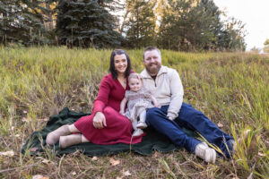 Littleton family photographer Fly'N B park Highlands Ranch Colorado one year old baby mother father child daughter little girl photography fall cake smash