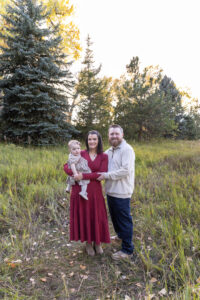 Littleton family photographer Fly'N B park Highlands Ranch Colorado one year old baby mother father child daughter little girl photography fall cake smash