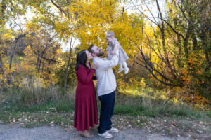 Littleton family photographer Fly'N B park Highlands Ranch Colorado one year old baby mother father child daughter little girl photography fall cake smash