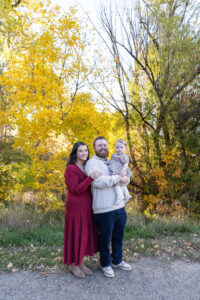 Littleton family photographer Fly'N B park Highlands Ranch Colorado one year old baby mother father child daughter little girl photography fall cake smash
