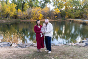 Littleton family photographer Fly'N B park Highlands Ranch Colorado one year old baby mother father child daughter little girl photography fall cake smash