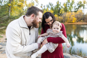 Littleton family photographer Fly'N B park Highlands Ranch Colorado one year old baby mother father child daughter little girl photography fall cake smash