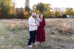 Littleton family photographer Fly'N B park Highlands Ranch Colorado one year old baby mother father child daughter little girl photography fall cake smash