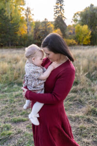 Littleton family photographer Fly'N B park Highlands Ranch Colorado one year old baby mother father child daughter little girl photography fall cake smash
