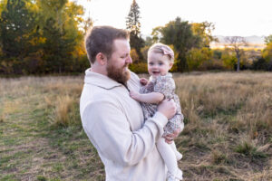 Littleton family photographer Fly'N B park Highlands Ranch Colorado one year old baby mother father child daughter little girl photography fall cake smash