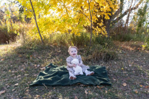 Littleton family photographer Fly'N B park Highlands Ranch Colorado one year old baby mother father child daughter little girl photography fall cake smash