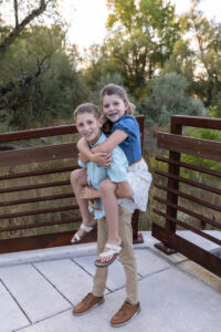 Littleton family photographer Stone House in Lakewood Colorado kids mother father photography brother sister fall sunset golden hour leaves siblings