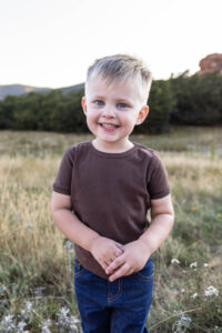 Littleton family photographer mother father son child little boy Colorado South Valley Park red rocks photography sunset