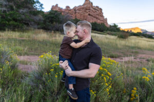 Littleton family photographer mother father son child little boy Colorado South Valley Park red rocks photography sunset