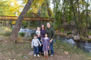 Littleton family photographer mini sessions Morrison Park fall photography Colorado dogs puppies couples mother father kids children siblings bridge river color brother sister baby