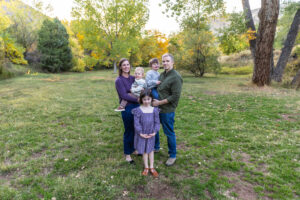 Littleton family photographer mini sessions Morrison Park fall photography Colorado dogs puppies couples mother father kids children siblings bridge river color brother sister baby