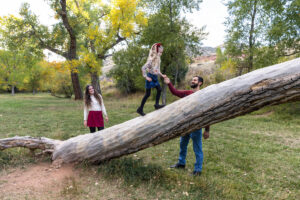 Littleton family photographer mini sessions Morrison Park fall photography Colorado dogs puppies couples mother father kids children siblings bridge river color brother sister baby