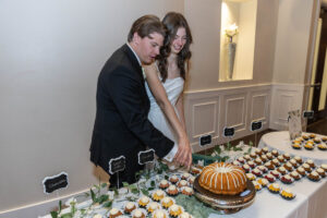 Littleton wedding photographer Colorado Ashley Ridge Wedgewood ceremony photography fall bride groom party reception cake bridal bridesmaids groomsmen bouquet rain outdoor cake cutting married