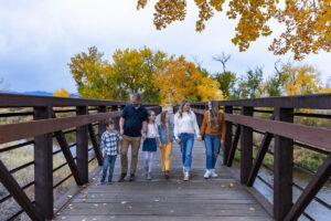 Littleton family photographer Carson Nature Center Colorado fall leaves South Platte river kids mother father children siblings brother sisters foothills bridge friends church