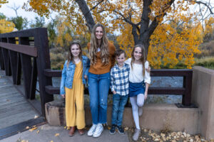 Littleton family photographer Carson Nature Center Colorado fall leaves South Platte river kids mother father children siblings brother sisters foothills bridge friends church