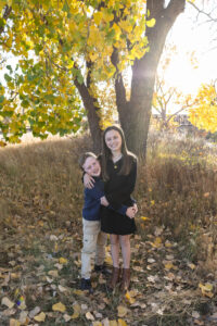 Littleton family photographer Carson Nature Center Colorado fall color bridge brother sister mother father siblings daughter son photography foothills dog fence log