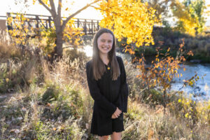 Littleton family photographer Carson Nature Center Colorado fall color bridge brother sister mother father siblings daughter son photography foothills dog fence log